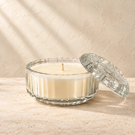 Petal | Lidded Cut Glass candle styled on a warm ivory background