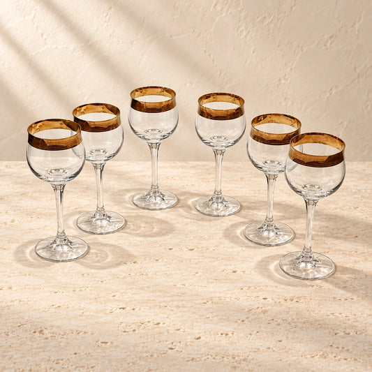 Theresienthal Concord Crystal Wine Glasses with 24K Gold Minton Rim — Set of 6 styled on a warm ivory background