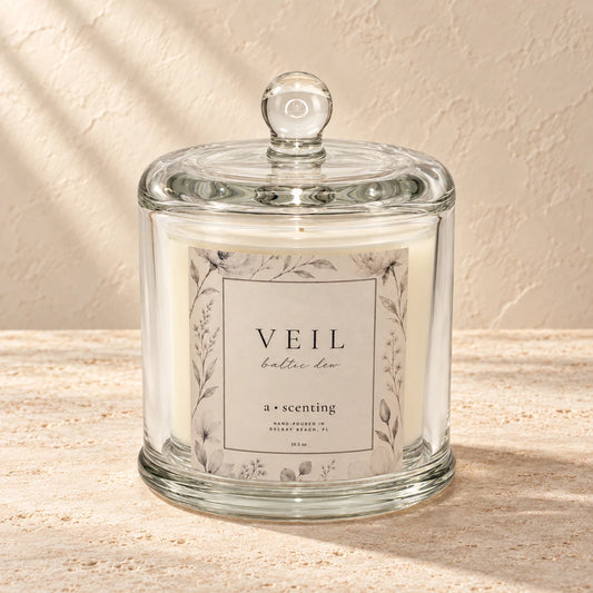Veil candle styled on a warm ivory background