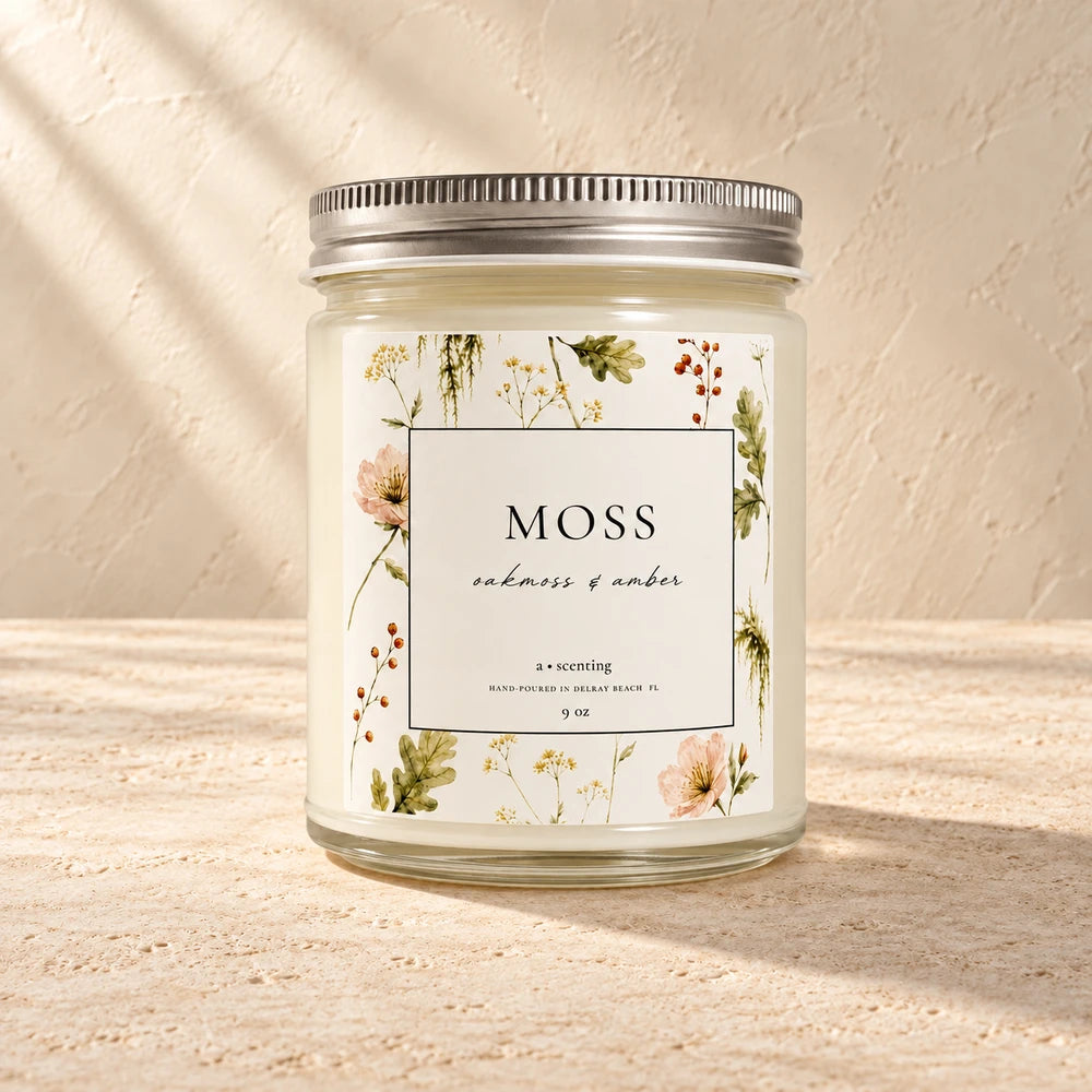 Moss | Oakmoss & Amber candle styled on a warm ivory background