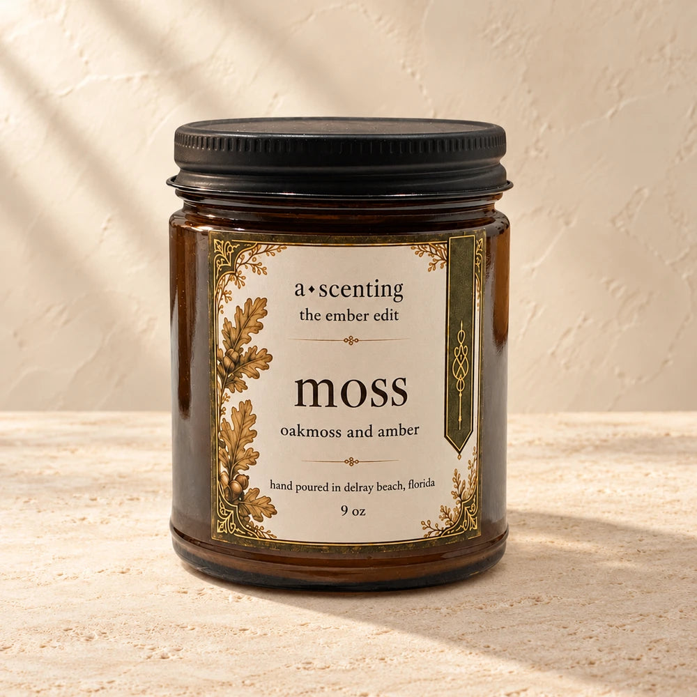 Moss | Oakmoss & Amber candle styled on a warm ivory background