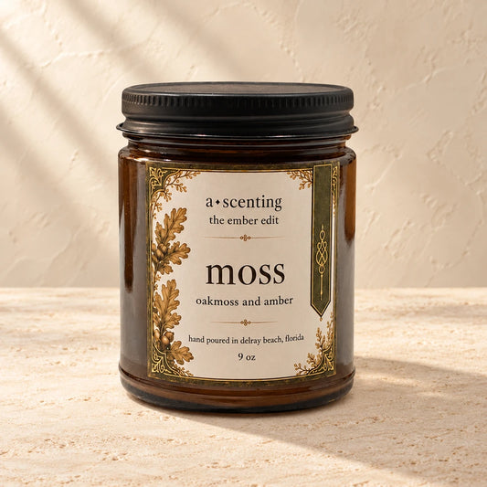 Moss | Oakmoss & Amber candle styled on a warm ivory background