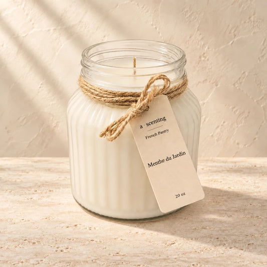 Menthe du Jardin candle styled on a warm ivory background