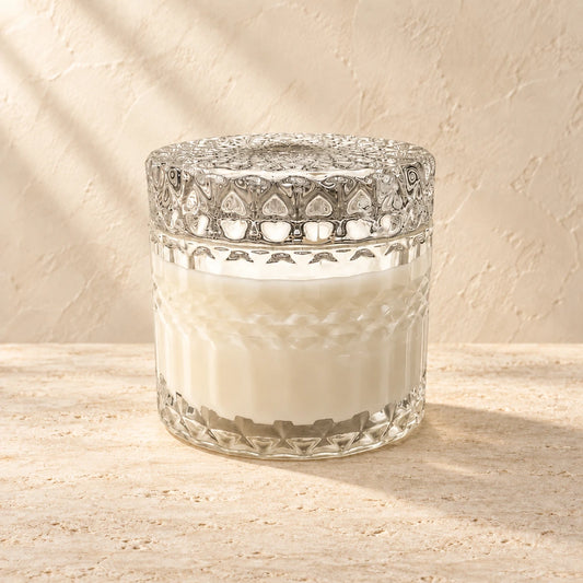 Capri candle styled on a warm ivory background