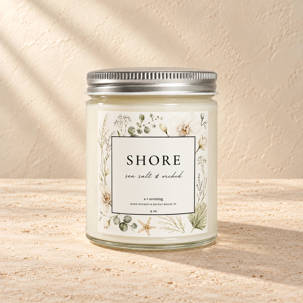 Shore | Sea salt & orchid candle styled on a warm ivory background
