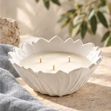 Shore candle in a white vintage porcelain flower bowl with soft blue linen